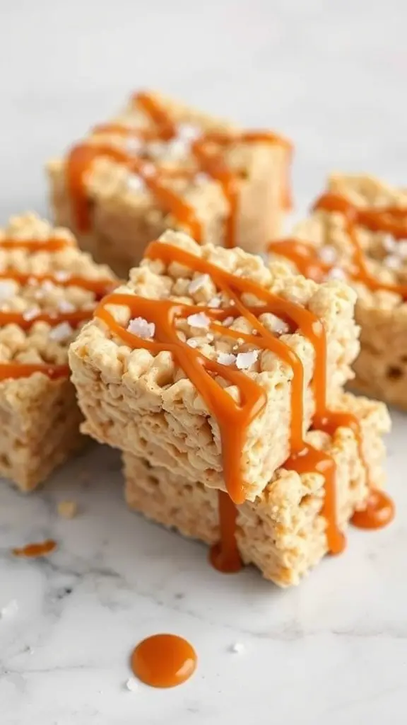 A stack of salted caramel rice krispie treats drizzled with caramel and sprinkled with sea salt.