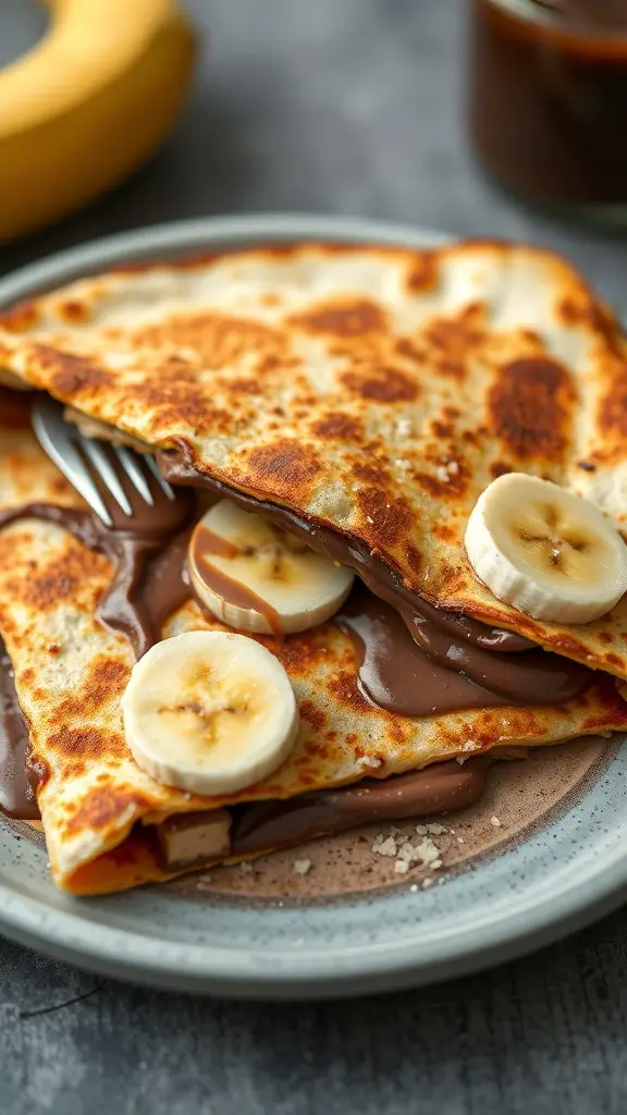 Nutella and banana quesadilla on a plate with a fork