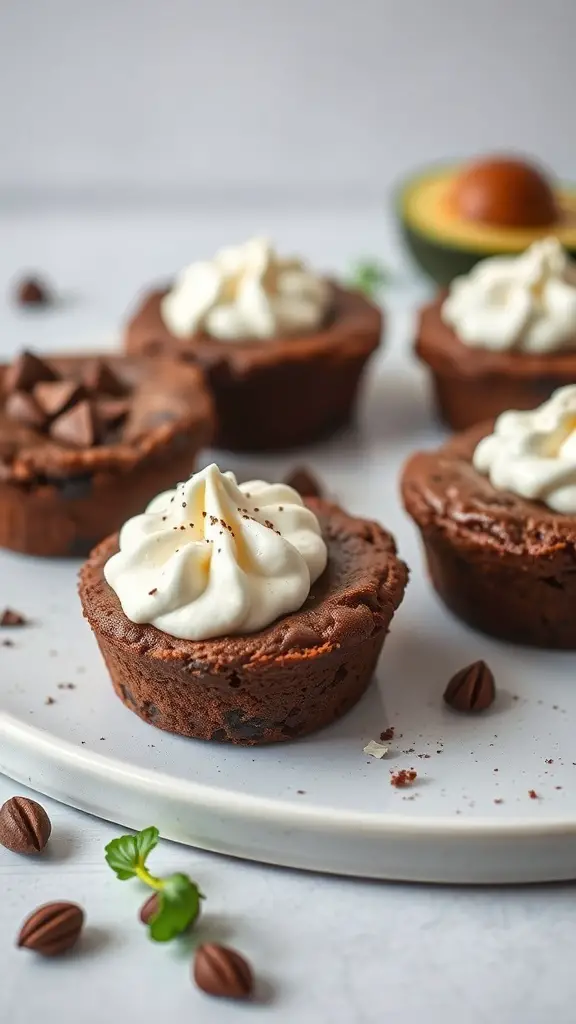 Chocolate Avocado Brownie Cups topped with whipped cream and chocolate chips